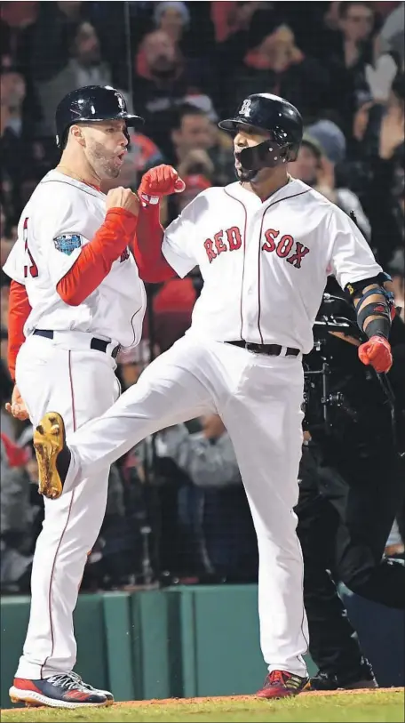  ?? Wally Skalij Los Angeles Times ?? BOSTON’S Eduardo Nunez, right, whoops it up with J.D. Martinez after Nunez’s three-run home run off Alex Wood in the seventh inning turned a 5-4 nail-biter into an 8-4 Boston lead. The decision to have Wood replace Pedro Baez was the key move of the game.