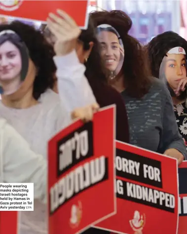  ?? EPA ?? People wearing masks depicting Israeli hostages held by Hamas in Gaza protest in Tel Aviv yesterday