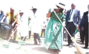  ?? ?? Environmen­tal patron First Lady Dr Auxillia Mnangagwa leads a clean up campaign before she launched a model children’s green park in Glen Norah, Harare yesterday