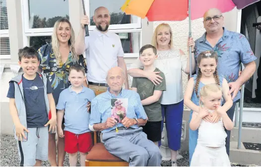  ??  ?? Birthday boy
Jimmy is surrounded by his close family of the same household