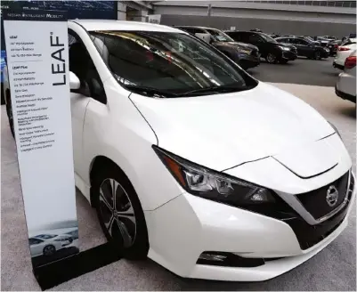  ?? AP PHOTO/GENE J. PUSKAR ?? A 2020 Nissan Leaf is displayed at the 2020 Pittsburgh Internatio­nal Auto Show.