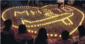  ?? [AP FILE PHOTO] ?? Relatives of Chinese passengers onboard Malaysia Airlines Flight 370 hold a candleligh­t vigil April 8, 2014, in Beijing, China. The search operations for the missing flight is about to become a cold case, officials say.