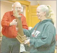  ?? RITA GREENE MCDONALD COUNTY PRESS ?? Mayor Gregg Sweeten presented the traveling trophy to Tonya Lewis, owner of Malt-Wich restaurant for being the most decorated business this holiday season in Pineville at the city council meeting Dec. 22.