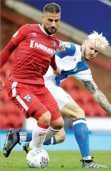  ??  ?? CRUNCH: Gillingham’s Max Ehmer and Blackburn’s Ben Gladwin battle for the ball