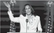  ?? ANDREW HARNIK/POOL VIA REUTERS ?? Democratic vice-presidenti­al nominee Kamala Harris speaks to supporters at the vistory rally for her and President-elect Joe Biden in Wilmington, Del. on Saturday.