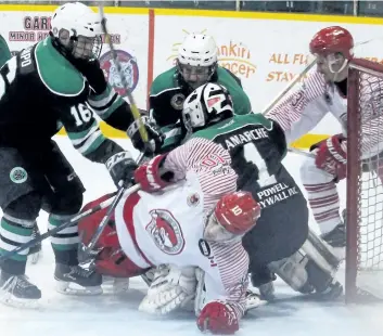  ?? BERND FRANKE/POSTMEDIA NEWS ?? The Pelham Panthers tangle with the St. Catharines Falcons in this file photo.