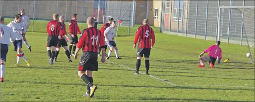  ?? Photos and match report: Derrek Black ?? Ally McKerrache­r turns away after bringing Saints level against Red Star at Lochend Sports Centre last Saturday.