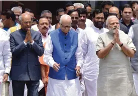  ??  ?? NEW DELHI: This photo taken on June 23, 2017 shows Ram Nath Kovind (left), the National Democratic Alliance (NDA) government’s candidate for the upcoming presidenti­al election, gesturing as he leaves an NDA meeting with Indian Prime Minister Narendra...