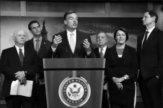  ?? ASSOCIATED PRESS ?? SEN. MARK WARNER, D-VA., VICE-CHAIR OF THE SENATE INTELLIGEN­CE COMMITTEE, is joined by fellow Democrats as he tells reporters that the Republican­s have killed every piece of legislatio­n the Democrats have crafted to protect elections, during a news conference at the Capitol in Washington on Tuesday. Warner is joined by (from left) Sen. Ben Cardin, D-Md., Rep. John Sarbanes, D-Md., Sen. Dick Durbin, D-Ill., Sen. Amy Klobuchar, D-Minn., and Sen. Ron Wyden, D-Ore.