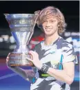  ?? REUTERS ?? Andrey Rublev poses with the trophy after his win at St Petersburg.