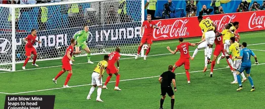  ?? GETTY IMAGES ?? Late blow: Mina leaps to head Colombia level