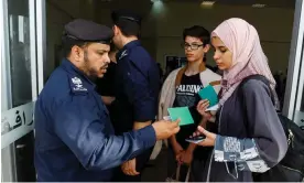  ?? Photograph: Ibraheem Abu Mustafa/Reuters ?? Palestinia­ns holding foreign passports wait for permission to leave Gaza at the Rafah border crossing with Egypt, November 2023.