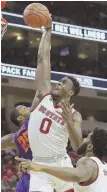  ?? AP PHOTO ?? ZERO-ING IN ON THE RIM: North Carolina State’s Abdul-Malik Abu gets ready to throw down a dunk during last night’s victory against 19th-ranked Clemson in Raleigh, N.C.