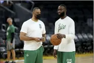  ?? JED JACOBSOHN — THE ASSOCIATED PRESS ?? Boston Celtics guard Jaylen Brown, right, speaks with coach Ime Udoka during NBA basketball practice in San Francisco, Wednesday, June 1, 2022. The Golden State Warriors are scheduled to host the Celtics in Game 1of the NBA Finals on Thursday.