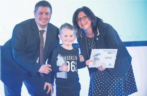  ??  ?? Iuestyn Bassett, has been honoured for his positivity and determinat­ion by Wales & West Housing at its annual Making a Difference Awards. Pictured with Stephen Dando of Day’s Rental and Sharon Lee, Wales & West Housing chairwoman