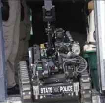  ??  ?? The New York State Police deploy a robot used in situations deemed too dangerous for a human for the emergency response exercise on Monday, March 18, 2019.