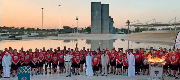  ?? Photo: Dubai Media Office ?? officials and athletes during the final stage of flame of hope lighting ceremony at martyrs’ memorial. —