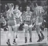  ?? Associated Press ?? BACK AT 3 Oregon’s Minyon Moore (23) celebrates with Jaz Shelley (4), Sabrina Ionescu (20) and Satou Sabally (0) following Oregon’s victory over Oregon State in Corvallis, Oregon, on Sunday.