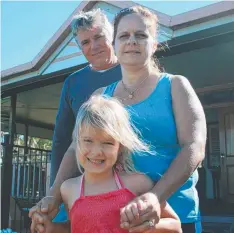  ??  ?? FAMILY: Alister and Kerri Pike with daughter Kyanna outside their Mission Beach home.