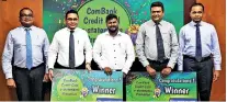  ??  ?? From left: Deputy General Manager Marketing Hasrath Munasinghe, Chief Operating Officer Sanath Manatunge, winners Y.W. George Amila Yatanwala and H.B. Ararchchig­e Darshana Maduranga and Commercial Bank Card Centre Head Thusitha Suraweera