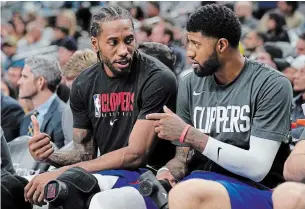  ?? DARREN ABATE THE ASSOCIATED PRESS FILE PHOTO ?? Kawhi Leonard, left, and Paul George, the two best players on the Los Angeles Clippers, were ruled out for Tuesday’s game in Atlanta because of the league’s health and safety protocols.