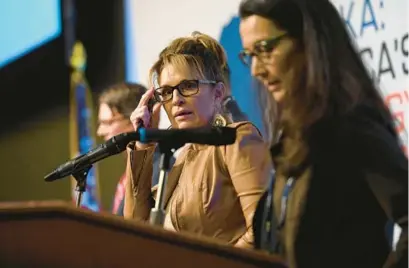  ?? MARC LESTER/AP ?? Sarah Palin joins other candidates on stage during a forum for U.S. House candidates at the Alaska Oil and Gas Associatio­n annual conference in Anchorage last Wednesday. Democrat Mary Peltola, right, won the special election.