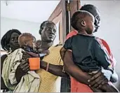  ?? MACKENZIE KNOWLES-COURSIN/AP ?? Mothers wait to receive therapeuti­c milk. The U.N. warns 1 million in South Sudan are close to dying of starvation.