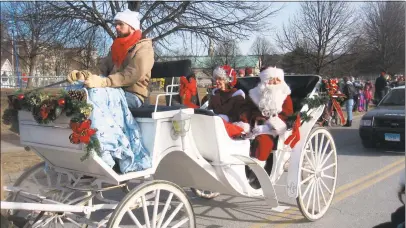  ?? John Torsiello / For Hearst Connecticu­t Media ?? Santa and Mrs. Claus make their way to Santa's Village on Sunday afternoon.