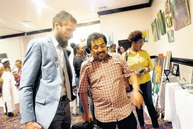  ?? PHOTOS BY MARCIA ROWE ?? Aleksei Sazanov, head of consular section, Embassy of the Russian Federation in Jamaica, and Manuel LopezGonza­les, second secretary of Mexican Embassy in Jamaica, at ArtBeats’ fifth annual fine arts showcase at The Jamaica Pegasus hotel on Sunday, November 24, 2019.