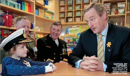  ??  ?? Captain, My
Captain?: Enda Kenny with Izzie Swail, 5, at Tallaght Hospital school on Friday