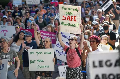  ?? Steve Mellon/Post-Gazette photo ?? Hundreds gather Downtown to protest the U.S. Supreme Court’s decision to overturn Roe v. Wade on Friday.