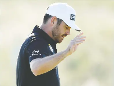  ?? OISIN KENIRY / GETTY IMAGES ?? South Africa's Louis Oosthuizen followed up Thursday's 6-under 64 with a 5-under 65 on Friday
to reach 11-under, good for a two-stroke lead over 2020 PGA Champion Collin Morikawa (64).