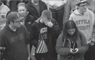  ?? SPENCER PLATT, GETTY IMAGES ?? People attend a vigil at Boston Common on Tuesday for victims of the Boston Marathon bombings. Two bombs exploded near the marathon finish line on Monday, killing three people and injuring more than 170.