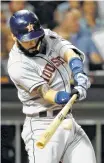  ?? Jon Durr / Getty Images ?? Marwin Gonzalez delivers an RBI double for the Astros in the sixth inning Thursday.