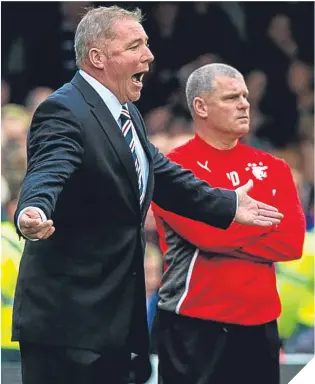  ??  ?? ■ Ian Durrant on the sidelines with Ally McCoist during Rangers’ climb back up the SPFL.