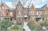  ??  ?? The three-storey detached home has a brick facade, gingerbrea­d trim and a double-entry door.