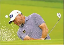  ?? John Raoux Associated Press ?? LEE WESTWOOD, who hasn’t won on the PGA Tour since 2010 but has been a force in Europe in his 40s, hits out of a bunker on the second hole at Bay Hill.