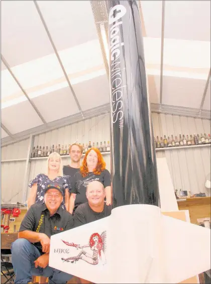  ?? Photo / Dean Taylor ?? The Nike team, left: Martin and Debbie van Tiel, centre: Chris North, right: Kelvin and Kim McVinnie, with the rocket base at their workshop.