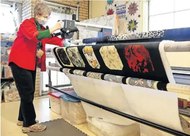  ?? LOUIS POST-DISPATCH/ TNS] [CHRISTINE TANNOUS/ST. ?? Associate Anne Hennig uses a machine to sew a quilt at City Sewing Room in St. Louis.