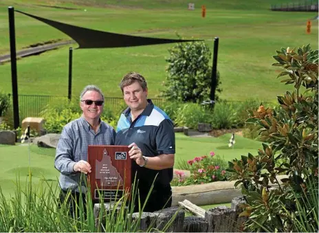  ??  ?? QUEENSLAND’S BEST: City Golf Club general manager Peter Constance (left) and golf operations manager Andrew Webb proudly accept the 2018 GMAQ Golf Club of the Year award.