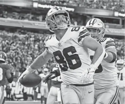  ?? SETH WENIG/AP ?? Cowboys tight end Dalton Schultz celebrates after catching a touchdown pass against the Giants on Dec. 19. Dallas averaged 407 yards and 31.2 points per game last season.