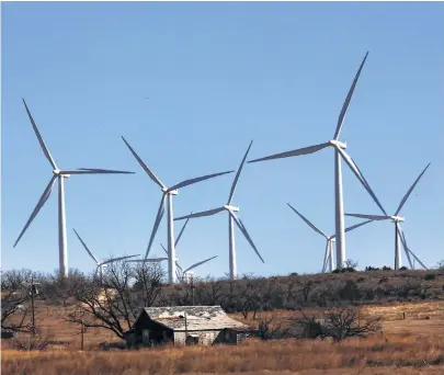  ?? Spencer Platt / Getty Images file ?? Turbines dominate the landscape at a wind farm in Colorado City, Texas. The state leads the U.S. in wind capacity.