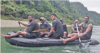  ?? Photo: Fiji Rugby Union ?? TOP: Fiji Airways Flying Fijians reps (close to camera from left) Henry Seniloli, Ben Volavola, Alivereti Veitokani, Jale Vatubua (partly obscured) and Viliame Mata paddling down the Namosi waters on August 21, 2019.