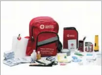  ?? JASON MONDAY — AMERICAN RED CROSS VIA AP ?? This photo provided by the American Red Cross shows the contents of an American Red Cross emergency preparedne­ss kit. Having the right emergency supplies in a ready-to-grab kit can reduce stress during evacuation­s or disasters.