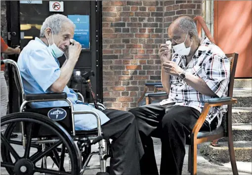  ?? ABEL URIBE/CHICAGO TRIBUNE ?? Antonio Talavera, 77, left, and his brother, Manuel, 82, wipe tears from their eyes during a second meeting Tuesday at the Center Home nursing home in Humboldt Park.