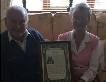  ??  ?? John O’Brien at his home in Gorey with his wife, Sheila, and his Seana Ghael award.