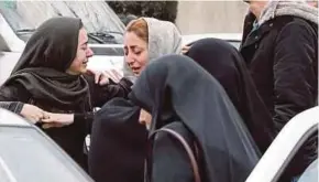  ?? EPA PIC ?? Relatives of passengers of an Iran Aseman Airline flight crying at the Mehrabad airport in Teheran yesterday.