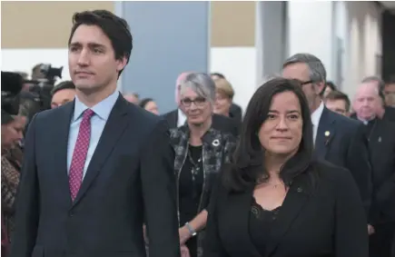  ?? CP FILE PHOTO ?? Prime Minister Justin Trudeau and Minister of Justice and then-attorney general Jody Wilson-Raybould take part in the grand entrance prior to the final report of the Truth and Reconcilia­tion commission on Dec. 15, 2015 in Ottawa.