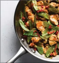  ?? (Milk Street via AP) ?? This recipe for stir-fried chicken and snow peas, with just six ingredient­s, was inspired by the popular Malaysian dish ayam paprik.