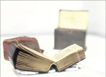  ?? PICTURE: AP/AFRICAN NEWS AGENCY (ANA) ?? A 10th century Qur’an is on display at Israel’s National Library in Jerusalem. The tiny Qur’an, unique in size and style, has gone on display for the first time as part of a collection of Islamic texts being shown to mark the Muslim holy month of...
